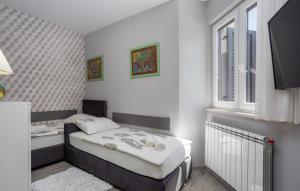 En eller flere senge i et værelse på Apartment Estate 2 - Island Krk by Villas Guide + 16 billeder