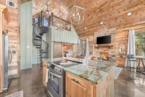 a kitchen with a stove top oven in a room at NEW Woodland Escape with Spa & Fire pit - Sleeps 4 in Mount Herman