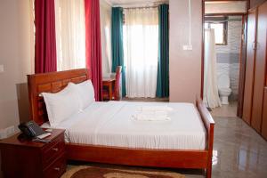 Tempat tidur dalam kamar di SEED HOTEL