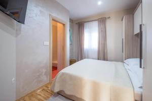 Postel nebo postele na pokoji v ubytování Turta apartment