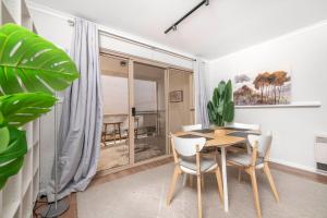 a dining room with a table and chairs at Stylish 2BR Apartment in Kingston Close to Lake in Kingston  +22 photos