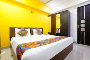 Postel nebo postele na pokoji v ubytování FabHotel Rio House Apartment
