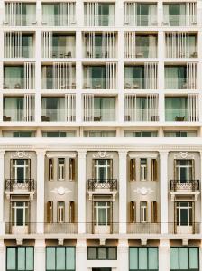 a facade of a building with windows and balconies at ON Residence - Small Luxury Hotels of the World in Thessaloniki