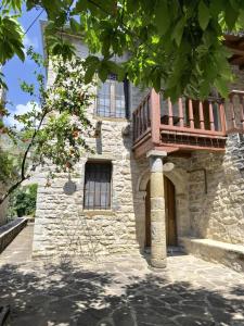 a building with a balcony on the side of it at The Mountain House -mountain getaway in Sirako +60 photos