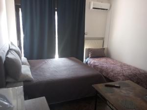 Postel nebo postele na pokoji v ubytování Executive center rooms