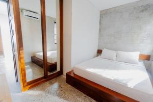 Postel nebo postele na pokoji v ubytování Samada Work Life Canggu
