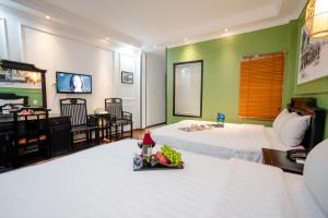 TV a/nebo společenská místnost v ubytování Hanoi Sunshine Hotel + 16 fotografií