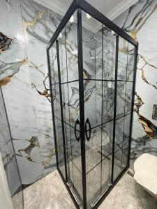 a room with a glass case with birds on the wall at Armar Hotel in Istanbul