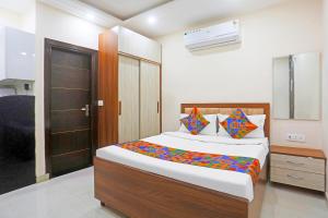 Ένα ή περισσότερα κρεβάτια σε δωμάτιο στο FabHotel The Hide Away