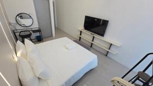 TV/Unterhaltungsangebot in der Unterkunft One Point Hotel TT3 Tabuan Tranquility