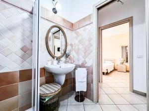 a bathroom with a sink and a mirror at Ginestra house in Olbia +17 photos