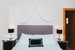 Postel nebo postele na pokoji v ubytování Hostal Mont Royal