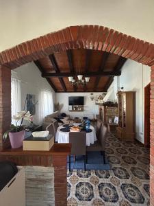 a living room with a table and a couch at Vila La Perla Istriana in Višnjan +41 photos
