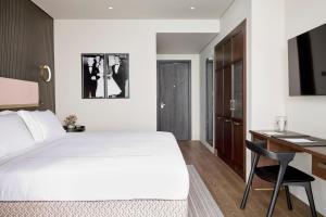 ON Residence - Small Luxury Hotels of the World客房内的一张或多张床位