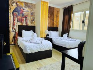 Voodi või voodid majutusasutuse Phoenix Pyramids View Inn toas