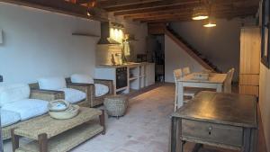a living room with a couch and a table at La Coma in gualba de Dalt