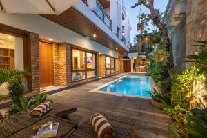 an image of a swimming pool in a house at Joon Canggu Apartment in Canggu