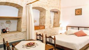 Llit o llits en una habitació de Trulli Panoramici