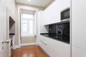 A cozinha ou kitchenette de FLH Baixa Blue Apartment