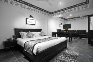 Postel nebo postele na pokoji v ubytování Liwa - The Transit Hotel, Bengaluru + 37 fotografií