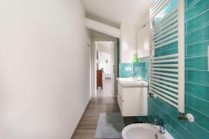 a bathroom with a sink and a toilet at Chianti House, Florence in Florence +56 photos