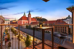 a view of a city from a balcony at Castle View Penthouse in Ljubljana
