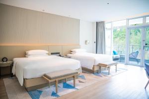 Postel nebo postele na pokoji v ubytování Sheraton Beihai Resort