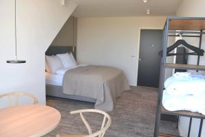 Postel nebo postele na pokoji v ubytování Hotel Kerteminde Strand