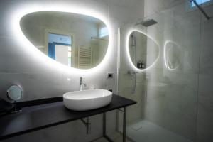 a bathroom with a sink and a mirror at Villa Mafalda in Pietra Ligure +72 photos