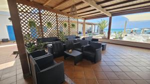 Area soggiorno di Vel Marì - Rooms on the Beach
