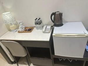 A kitchen or kitchenette at Tilon Hotel