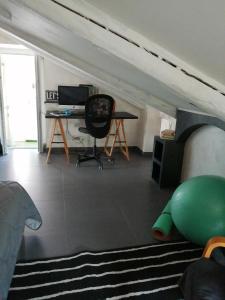 a room with a bed and a desk and a chair at Monica & Rocco's House in Venaria Reale