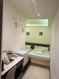 Postel nebo postele na pokoji v ubytování Tilon Hotel