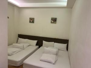 Postel nebo postele na pokoji v ubytování Tilon Hotel