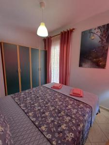 a bedroom with a bed in a room at PineParkView Apartment in Alexandroupoli +24 photos