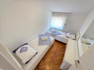 Posteľ alebo postele v izbe v ubytovaní DAMIR 2+2 more