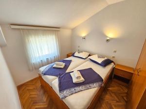 Posteľ alebo postele v izbe v ubytovaní DAMIR 2+2 more