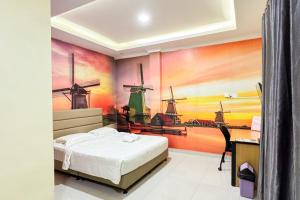 Urbanview Botania Meeting Point Batam by RedDoorz客房内的一张或多张床位