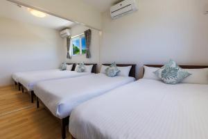 Ένα ή περισσότερα κρεβάτια σε δωμάτιο στο Large garden & BBQ possible! Kouri Island, 6 people can stay, parking lot available Kouri base Noa