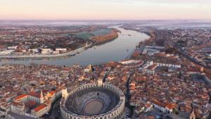 an aerial view of a city and a river at La Pitchoune Arles Centre in Arles