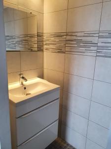 a bathroom with a sink and a mirror at Villa les seringas in Mougins