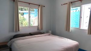 En eller flere senge i et værelse på Temple Light