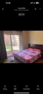 a picture of a bed in a room with a window at Golf Porto Marina VIP in El Alamein +29 photos