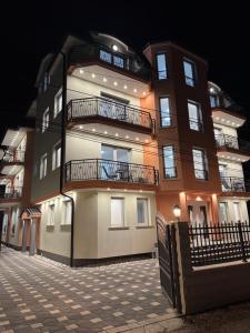 a tall building with balconies on the side of it at Villa Dana in Ohrid