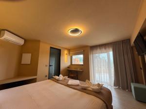 Postel nebo postele na pokoji v ubytování Mandragoras Eco Friendly Resort