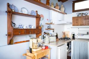 a kitchen with a stove and a counter top at La casina incantata in Trevignano Romano +12 photos