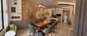 a dining room with a wooden table and chairs at Tu Shu Guan in Guanshan