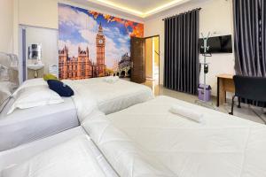 Urbanview Botania Meeting Point Batam by RedDoorz客房内的一张或多张床位