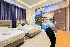Urbanview Botania Meeting Point Batam by RedDoorz客房内的一张或多张床位