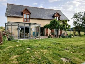 a house with a large yard in front of it at chez Aline et Michel in Ger